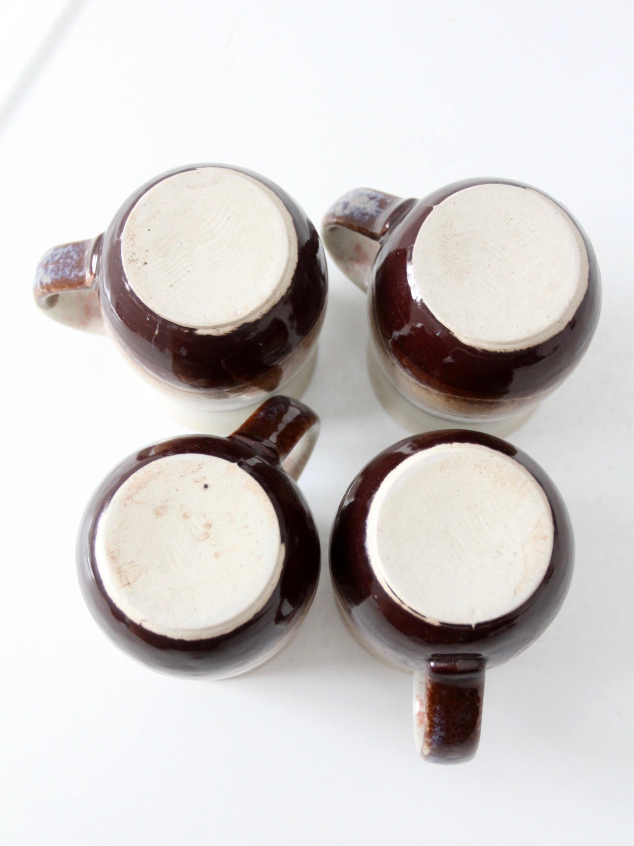 set of vintage handmade studio pottery mugs with wooden stand
