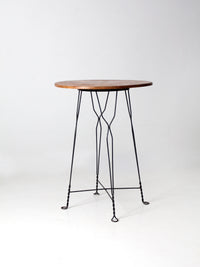 antique wrought iron and wood bistro table