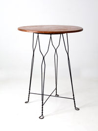 antique wrought iron and wood bistro table