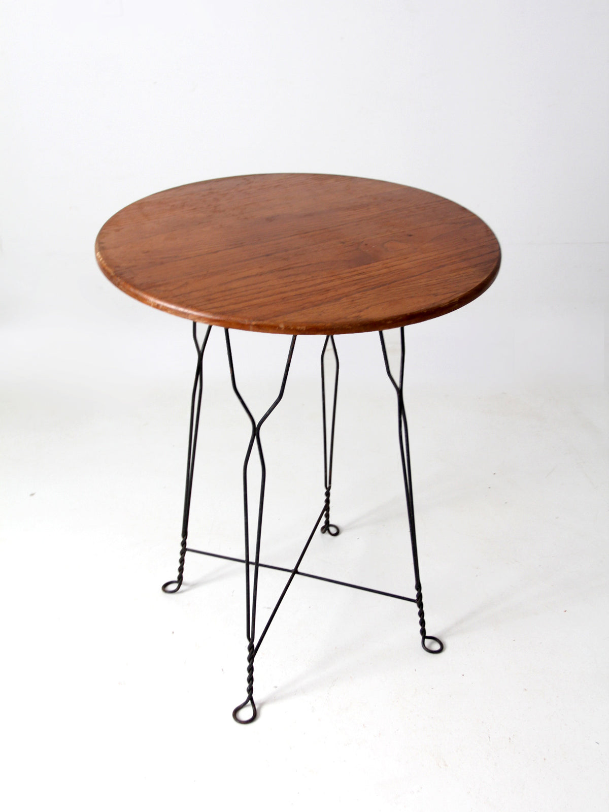 antique wrought iron and wood bistro table