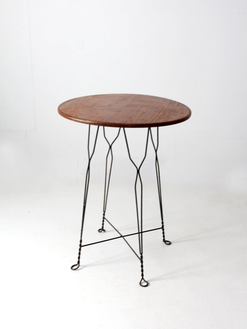 antique wrought iron and wood bistro table