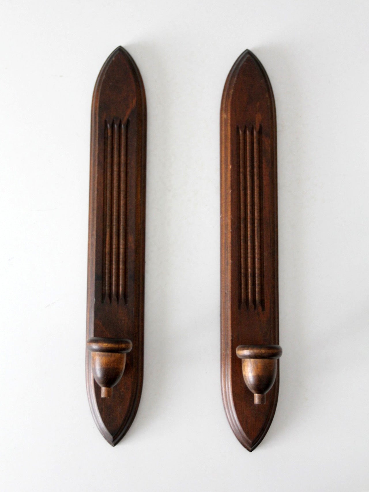 pair of mid-century gothic revival wood wall candle sconces