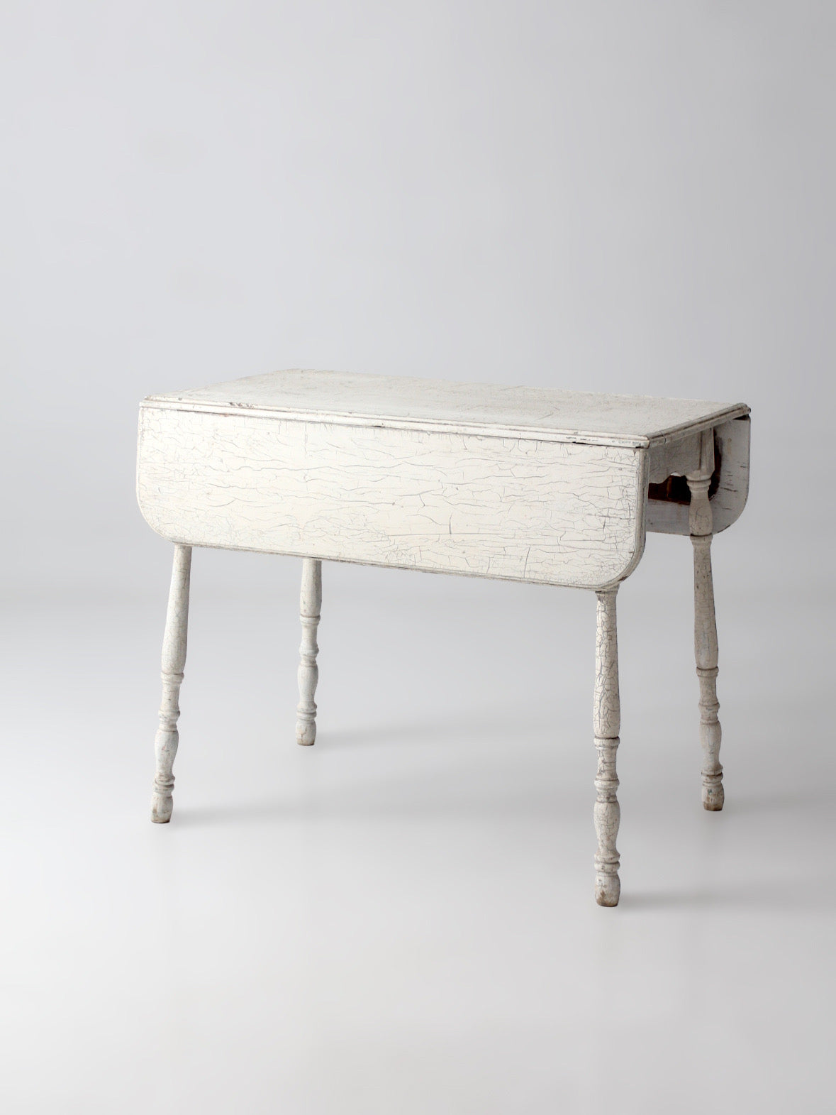 antique white painted drop leaf farmhouse table