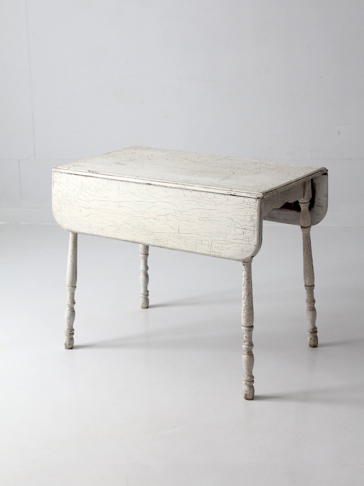 antique white painted drop leaf farmhouse table