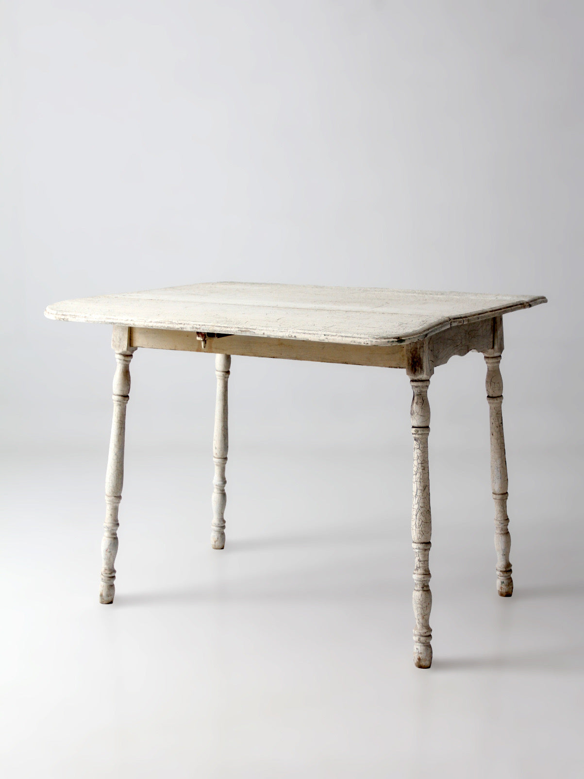 antique white painted drop leaf farmhouse table