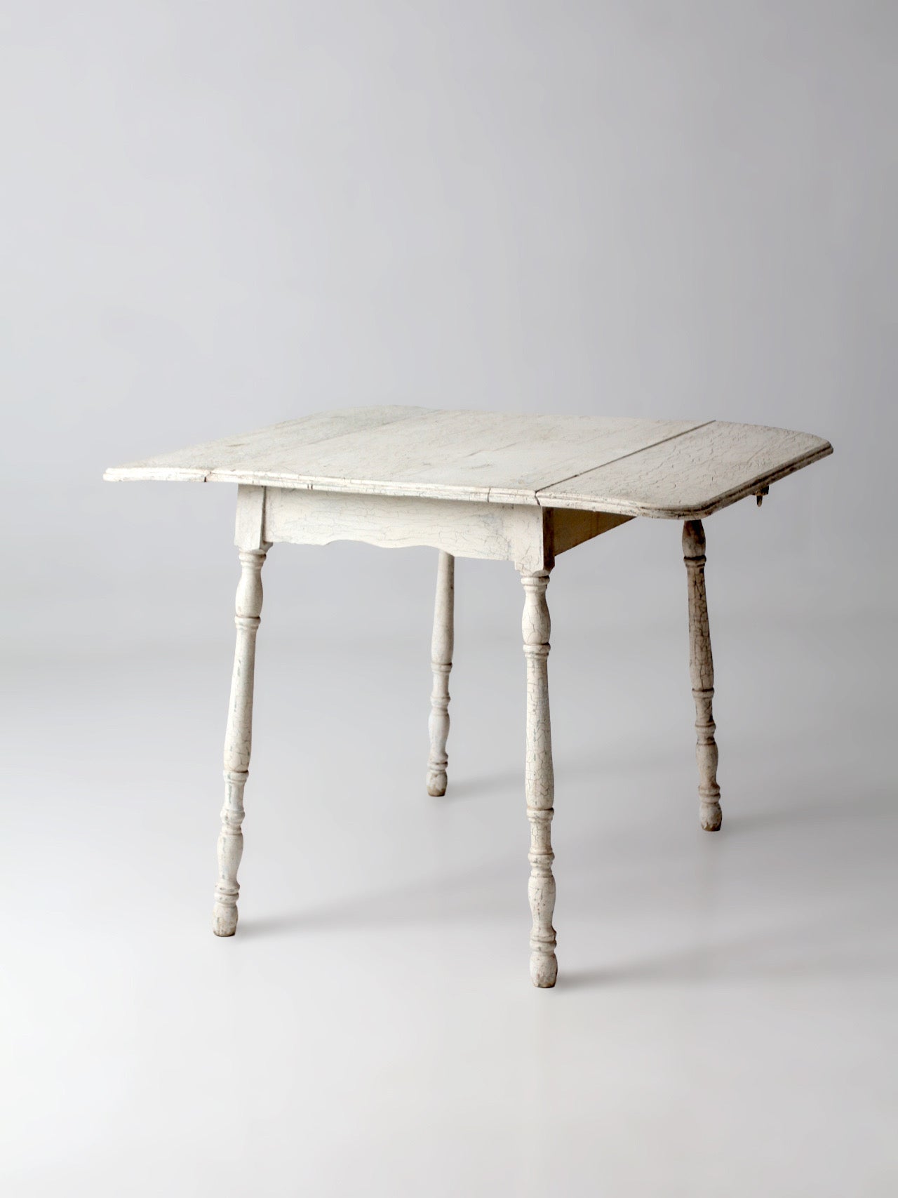 antique white painted drop leaf farmhouse table
