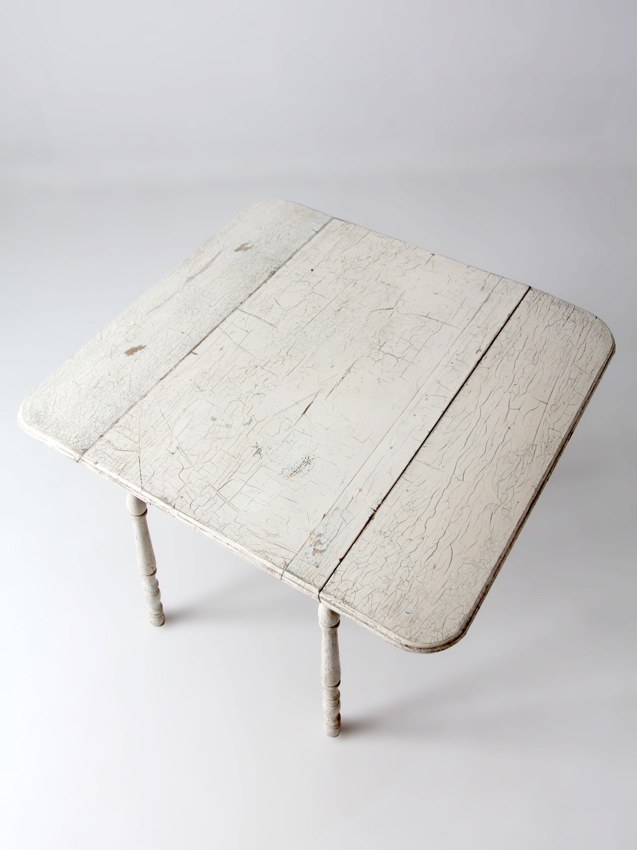 antique white painted drop leaf farmhouse table