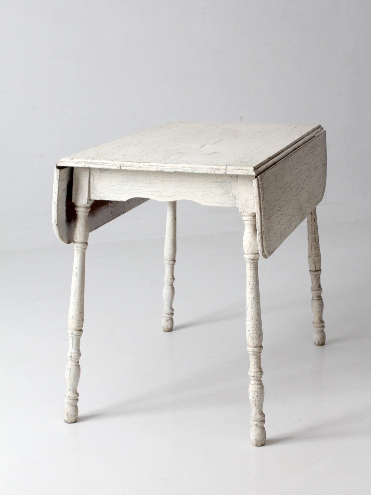 antique white painted drop leaf farmhouse table