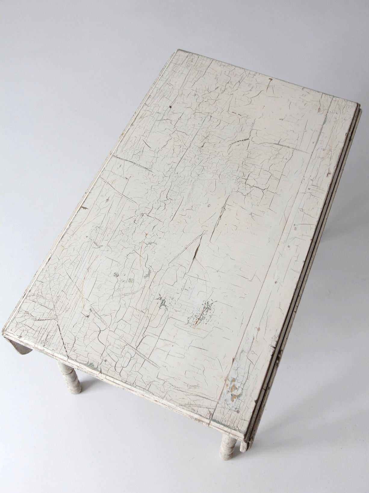 antique white painted drop leaf farmhouse table