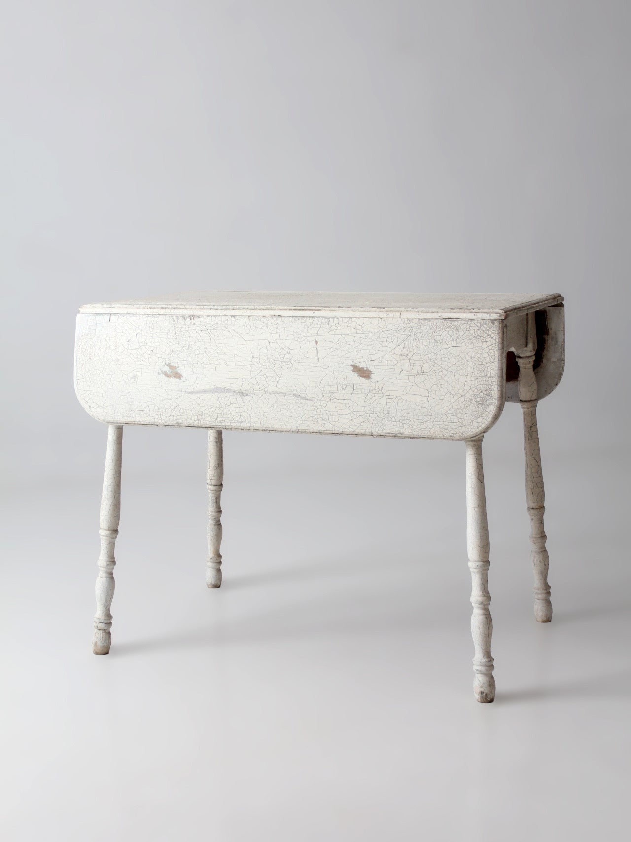 antique white painted drop leaf farmhouse table