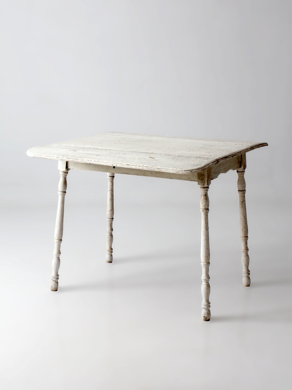 antique white painted drop leaf farmhouse table