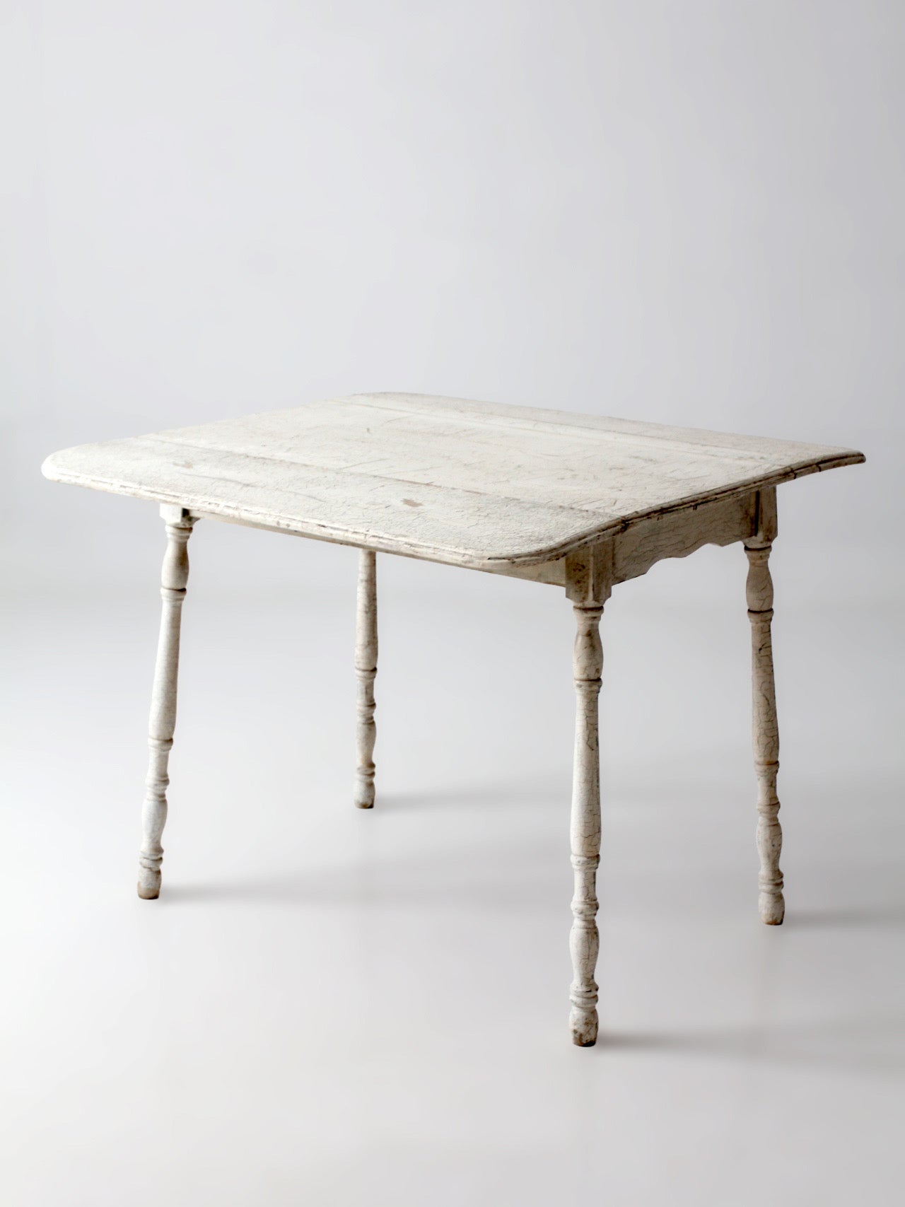 antique white painted drop leaf farmhouse table