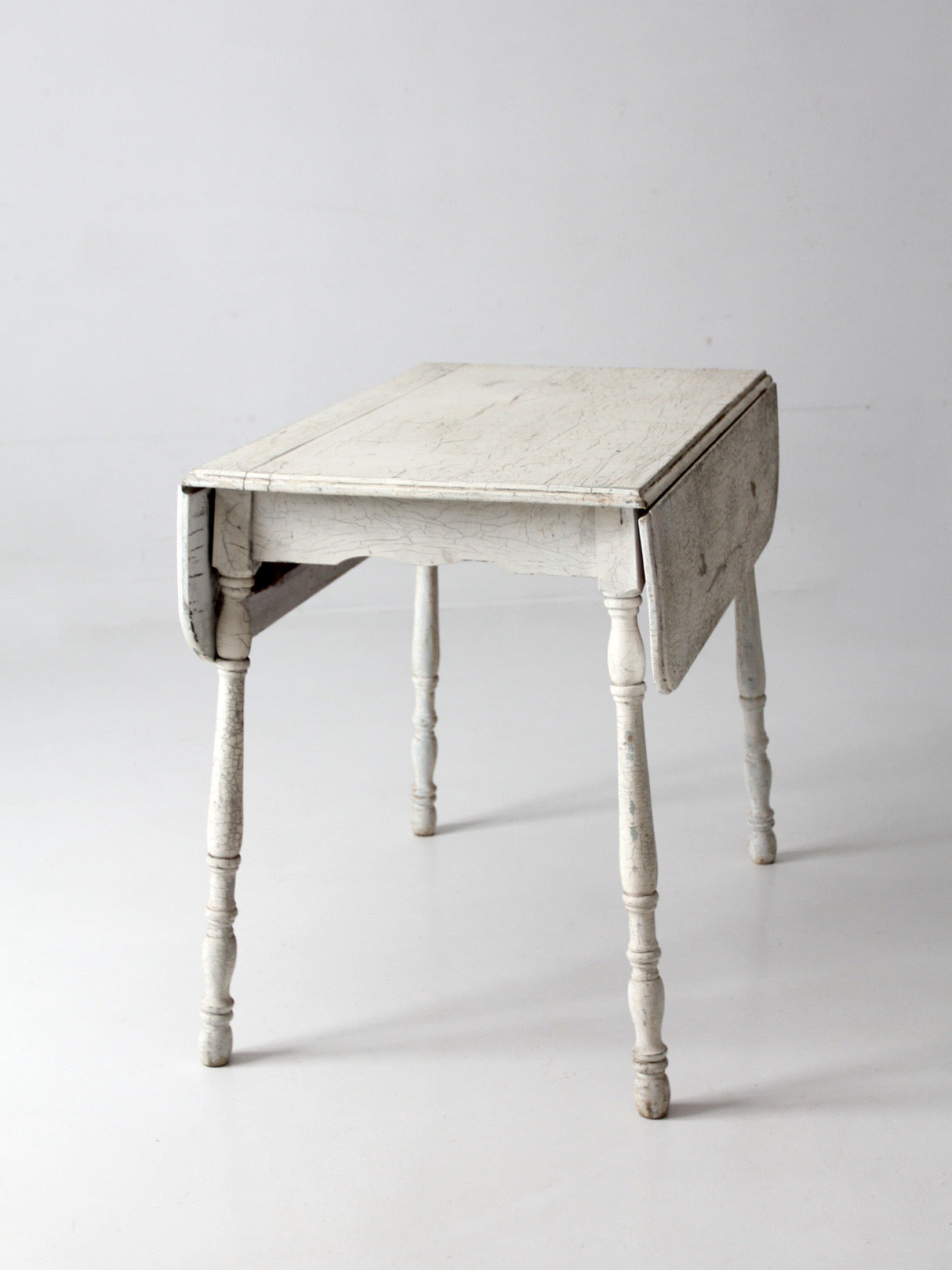antique white painted drop leaf farmhouse table