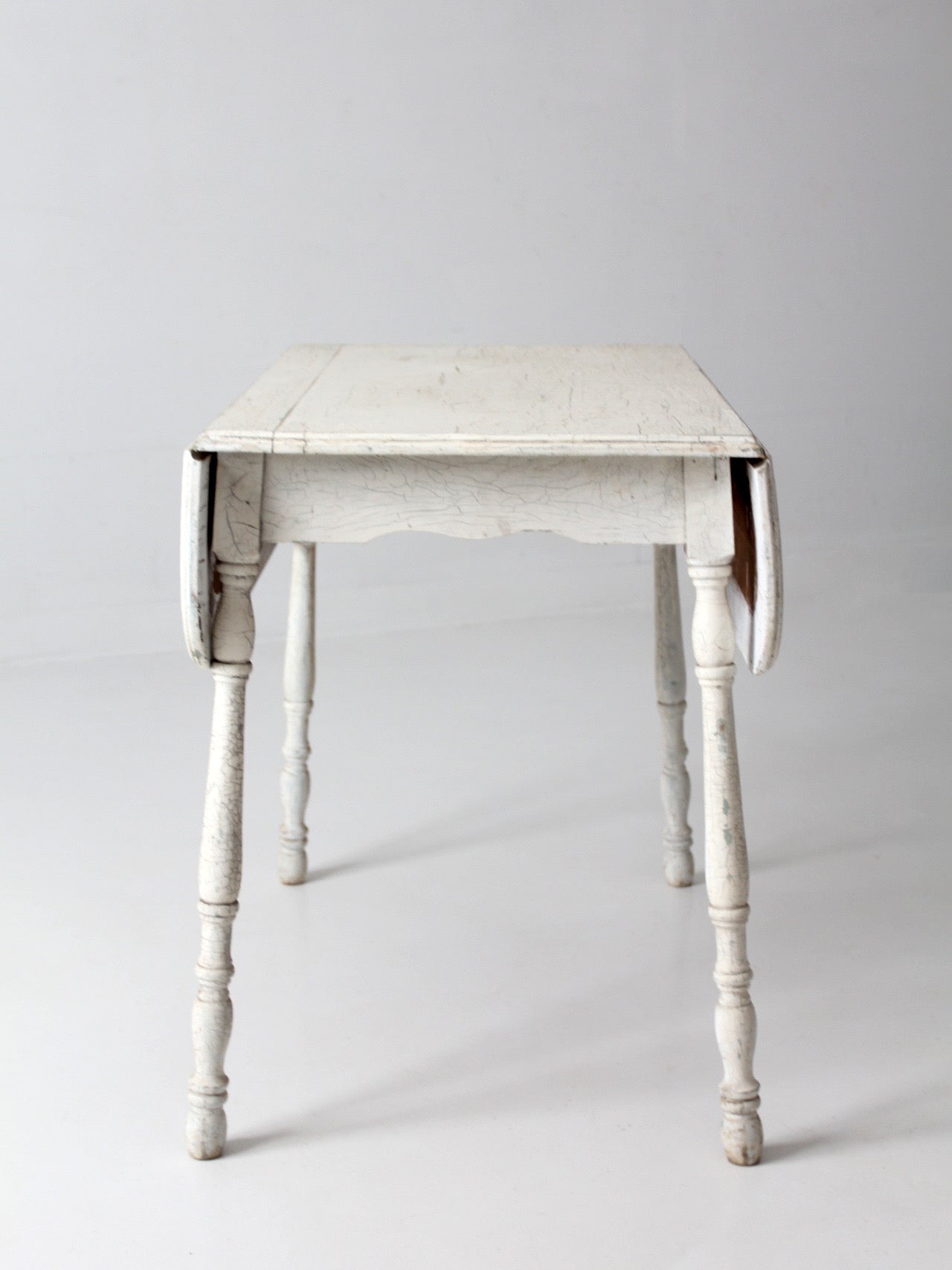 antique white painted drop leaf farmhouse table