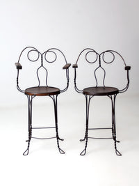pair of antique A.H. Andrews & Co. wire bar stools