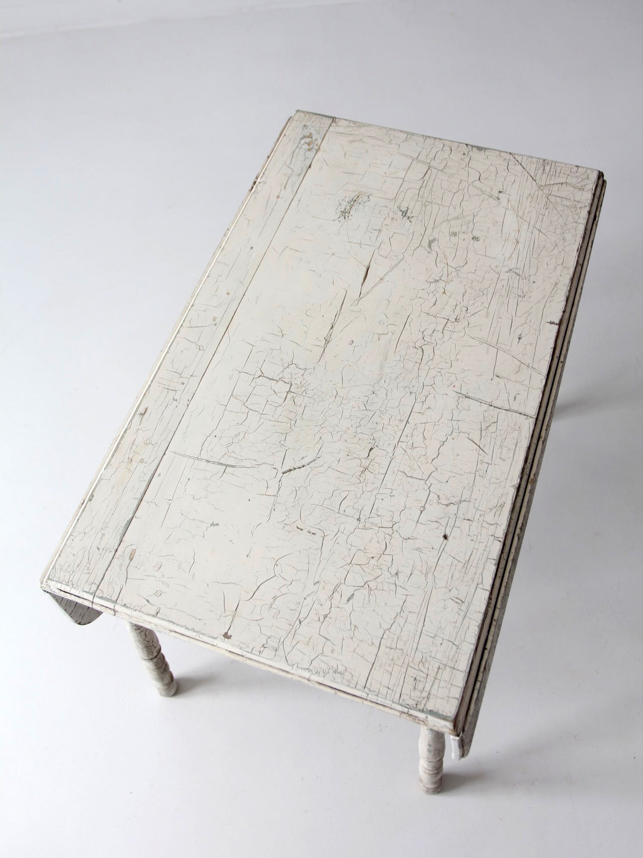 antique white painted drop leaf farmhouse table