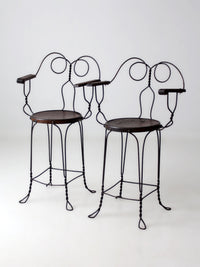 pair of antique A.H. Andrews & Co. wire bar stools