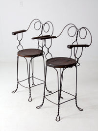 pair of antique A.H. Andrews & Co. wire bar stools