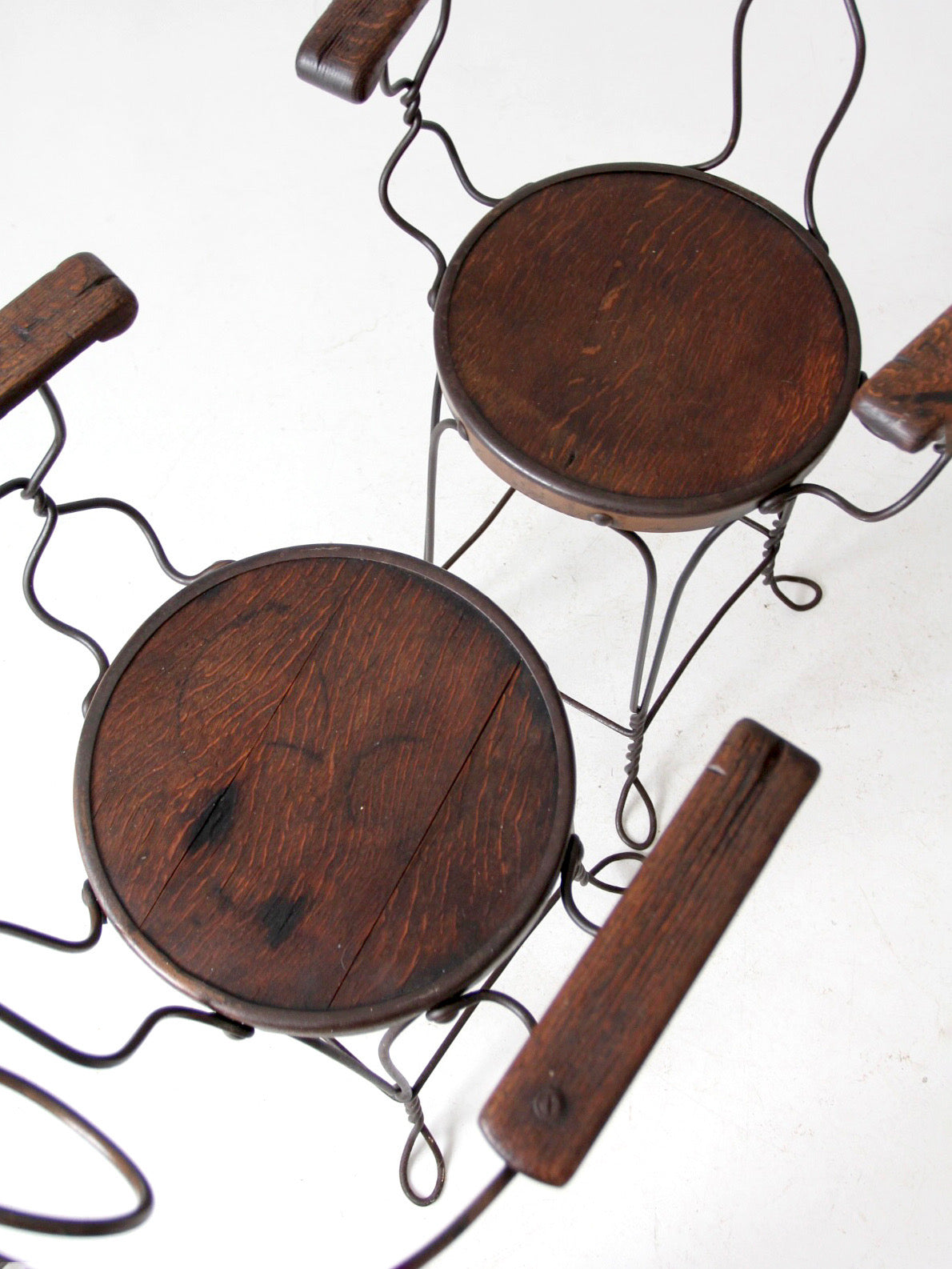 pair of antique A.H. Andrews & Co. wire bar stools
