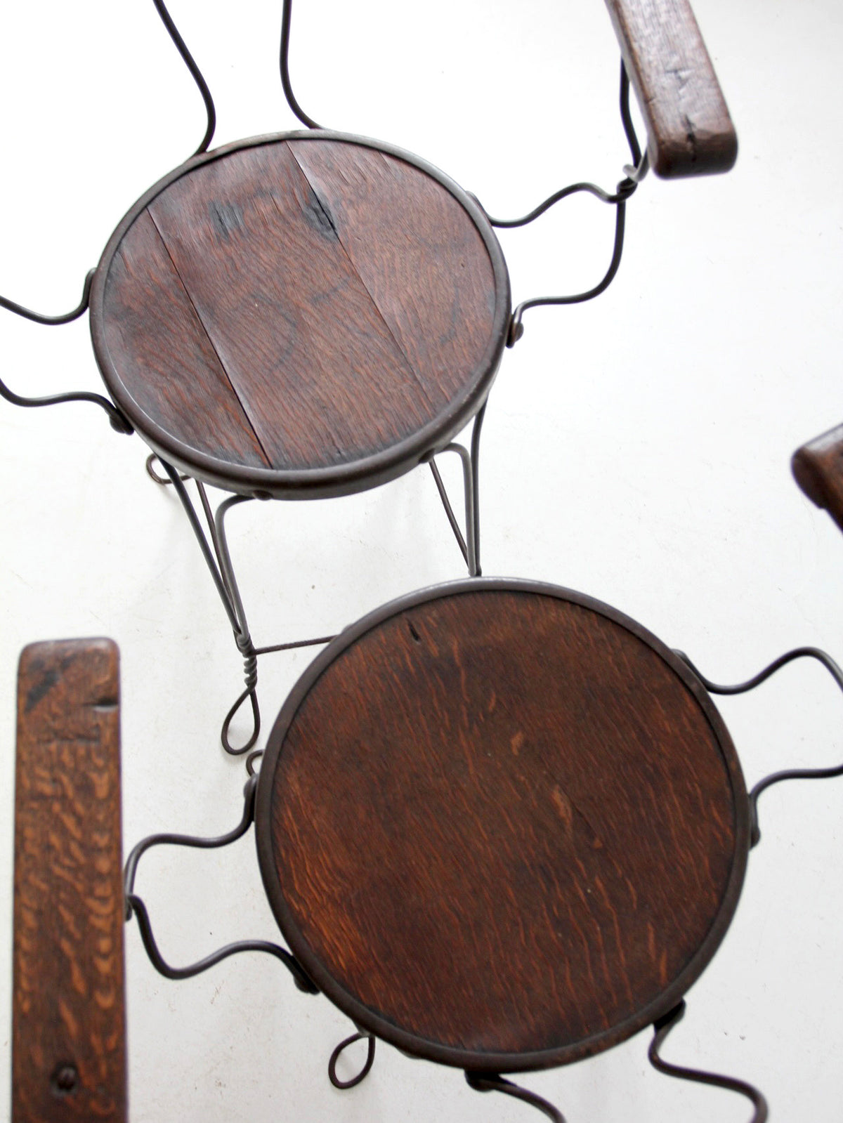 pair of antique A.H. Andrews & Co. wire bar stools