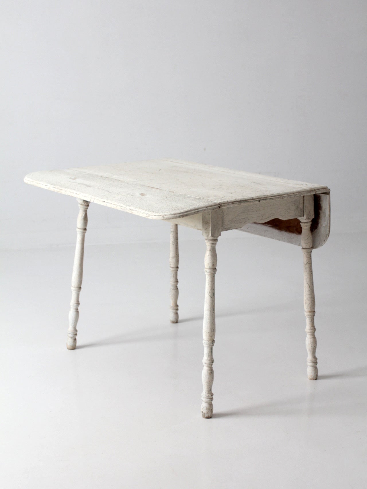 antique white painted drop leaf farmhouse table