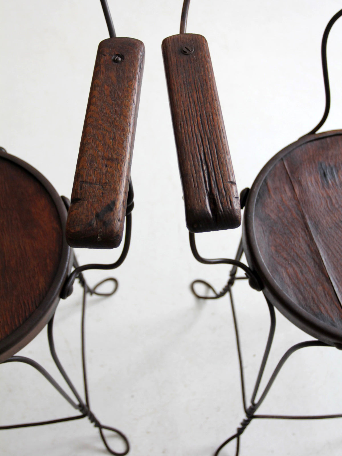 pair of antique A.H. Andrews & Co. wire bar stools