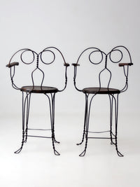 pair of antique A.H. Andrews & Co. wire bar stools