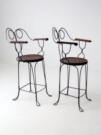 pair of antique A.H. Andrews & Co. wire bar stools