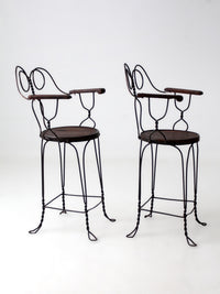 pair of antique A.H. Andrews & Co. wire bar stools
