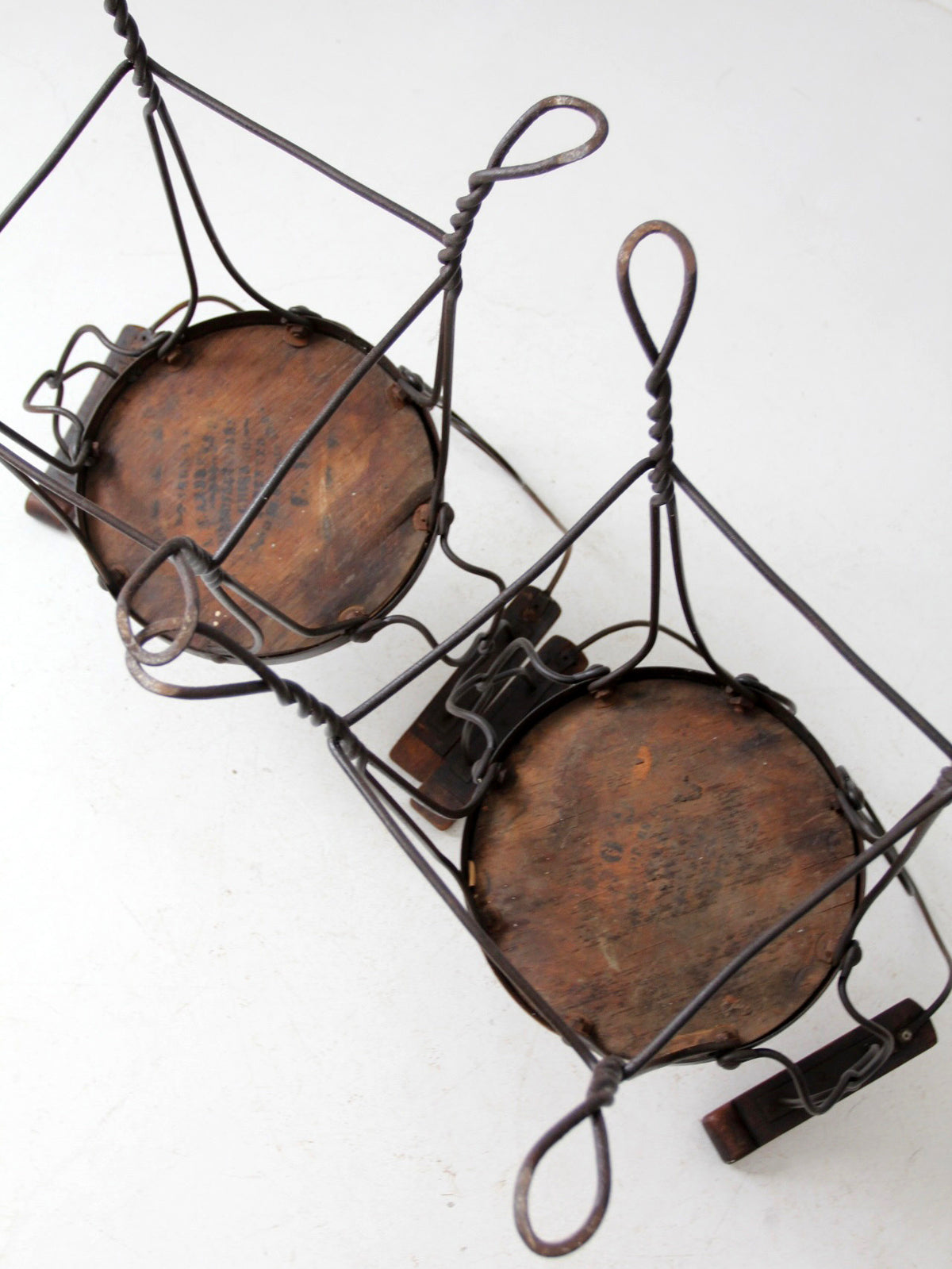 pair of antique A.H. Andrews & Co. wire bar stools
