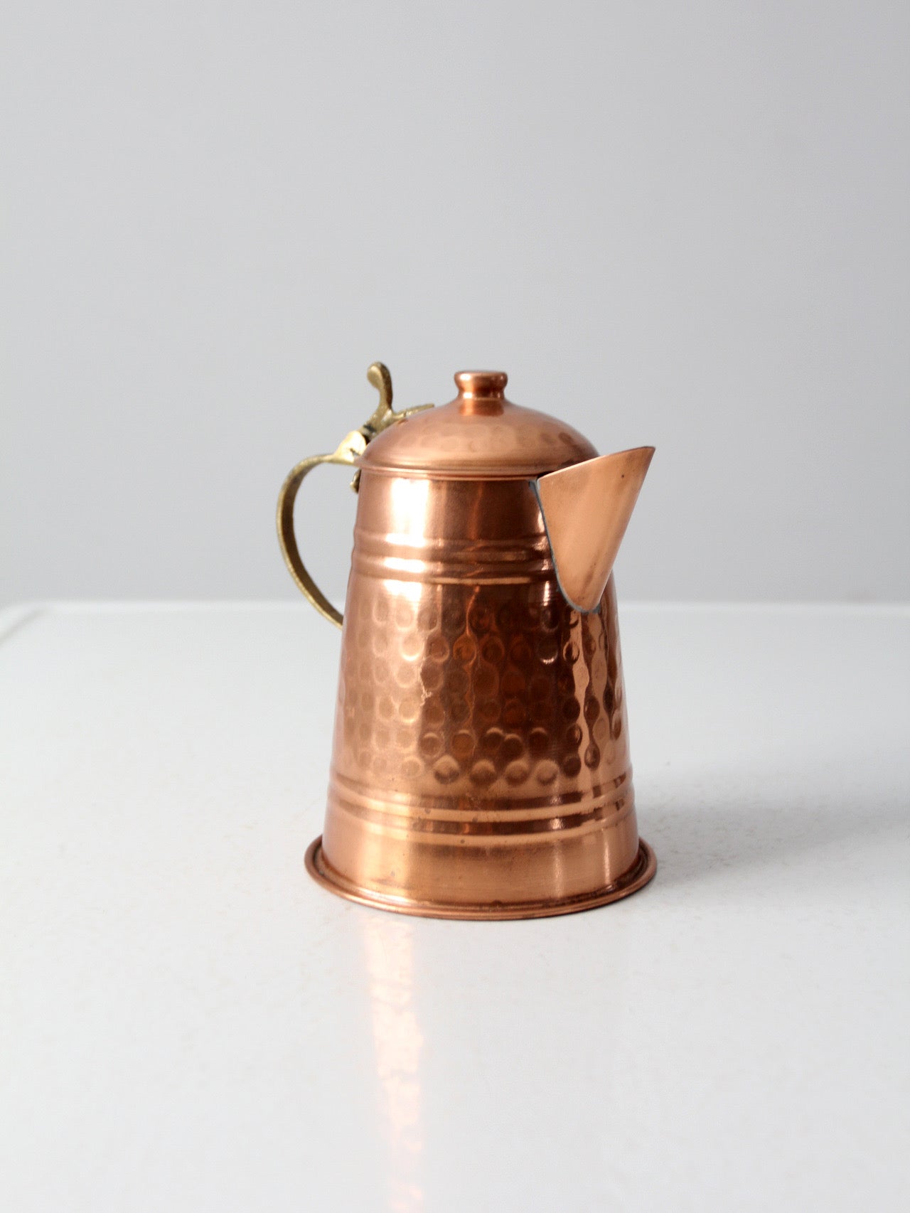 vintage hammered copper teapot with brass handle