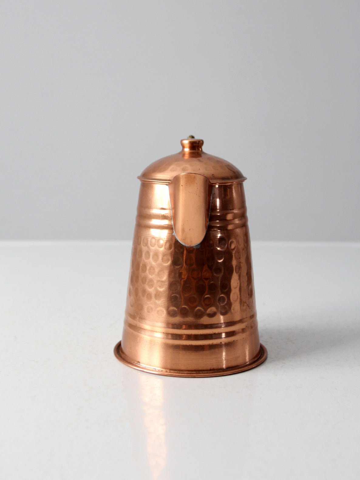 vintage hammered copper teapot with brass handle