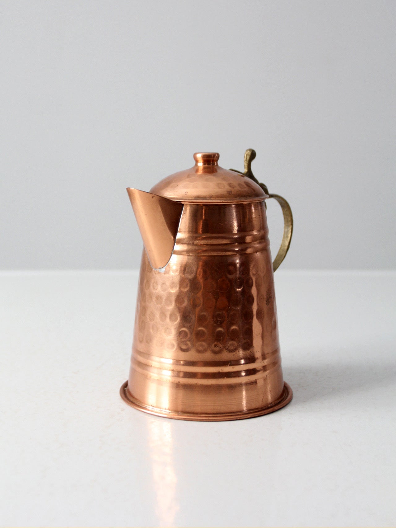vintage hammered copper teapot with brass handle