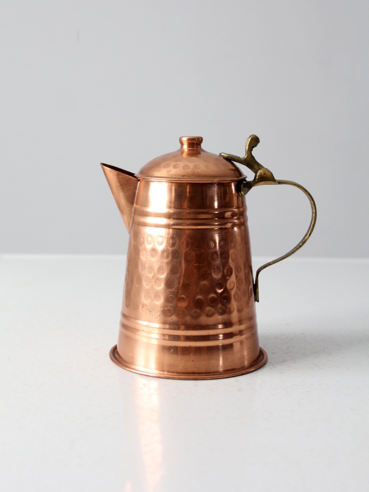 vintage hammered copper teapot with brass handle