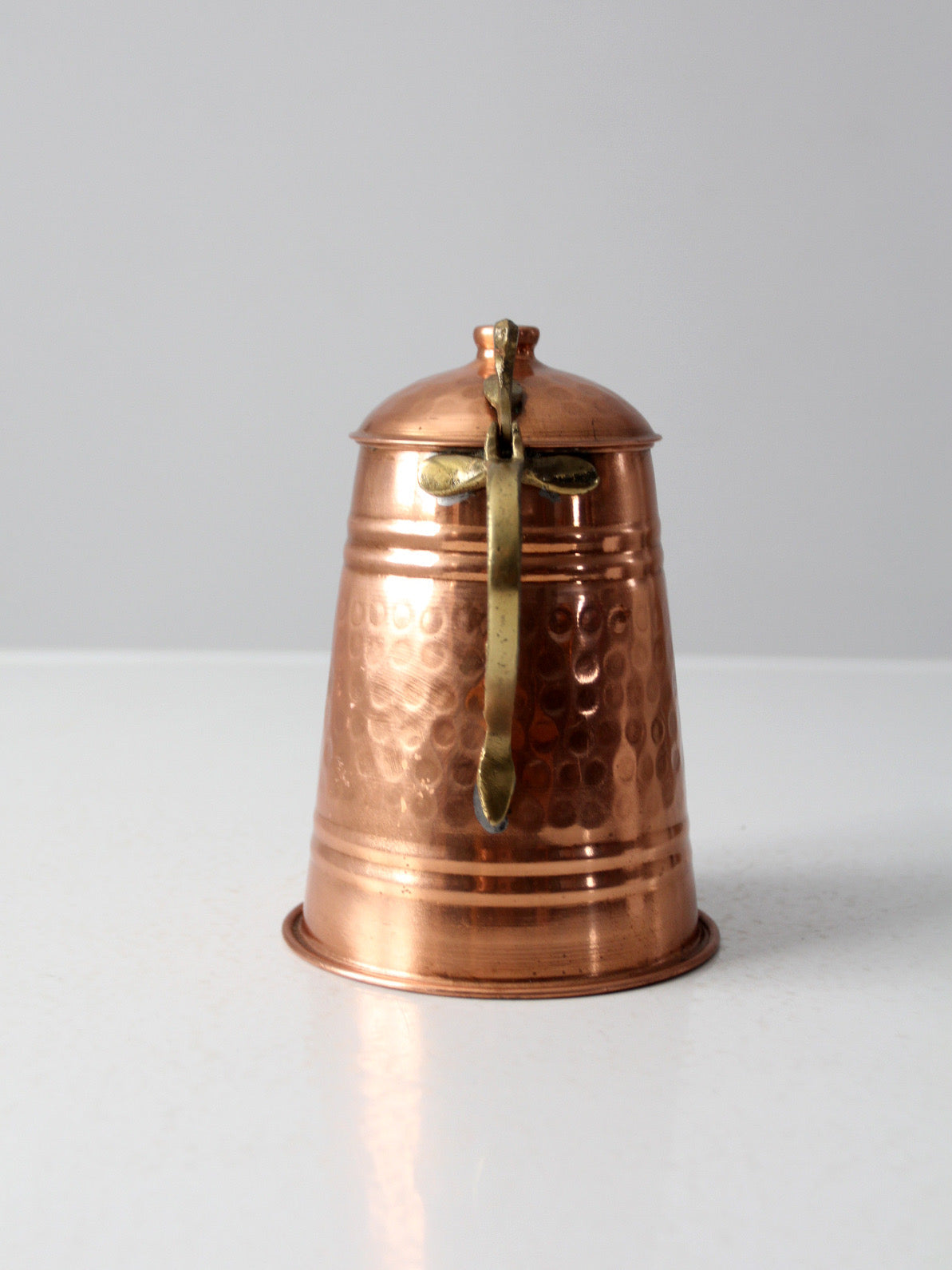 vintage hammered copper teapot with brass handle