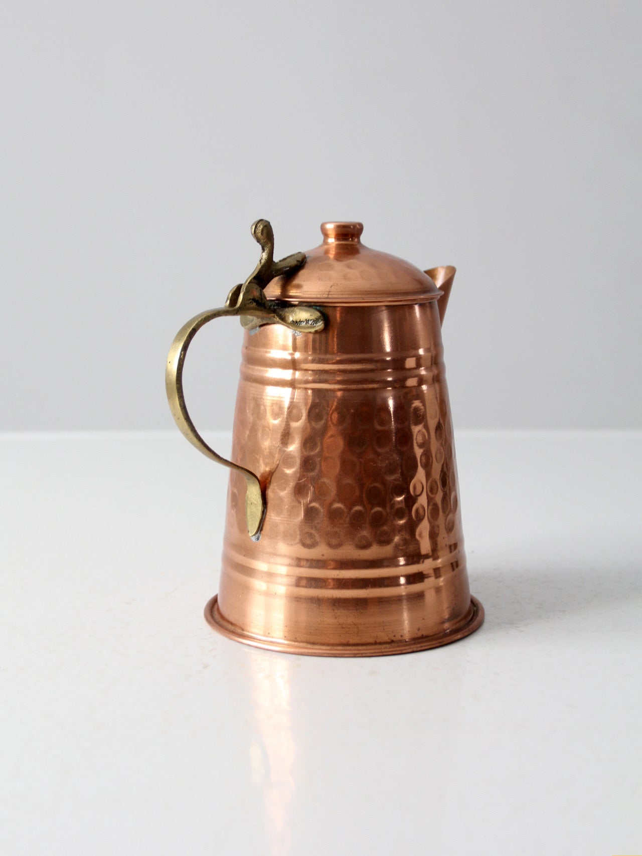 vintage hammered copper teapot with brass handle