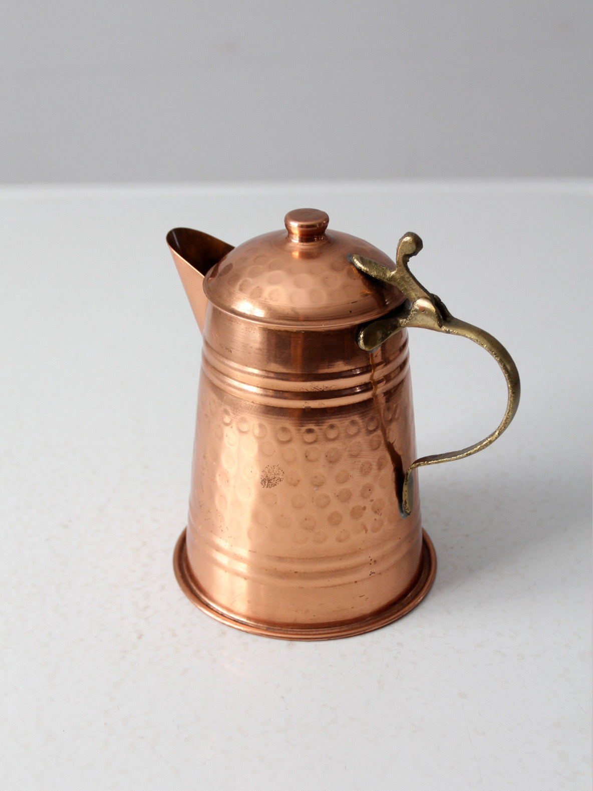vintage hammered copper teapot with brass handle