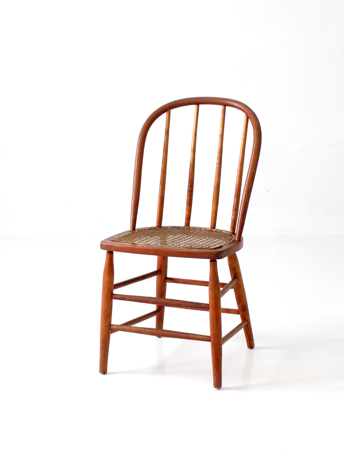 antique Windsor style cane seat chair