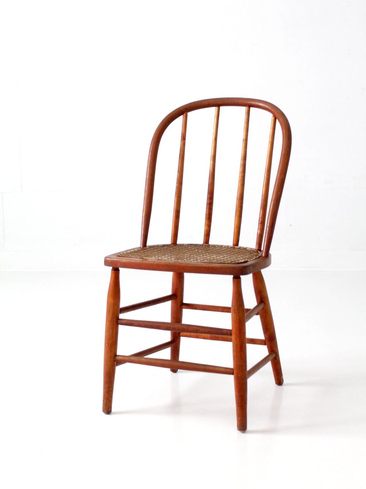 antique Windsor style cane seat chair