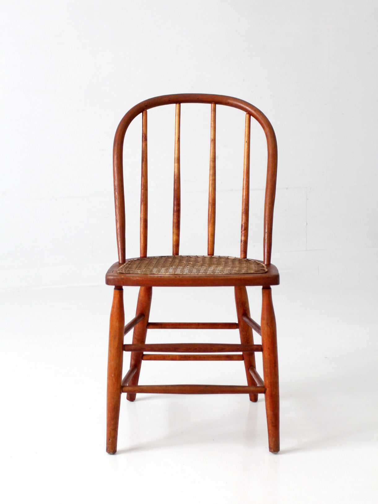 antique Windsor style cane seat chair