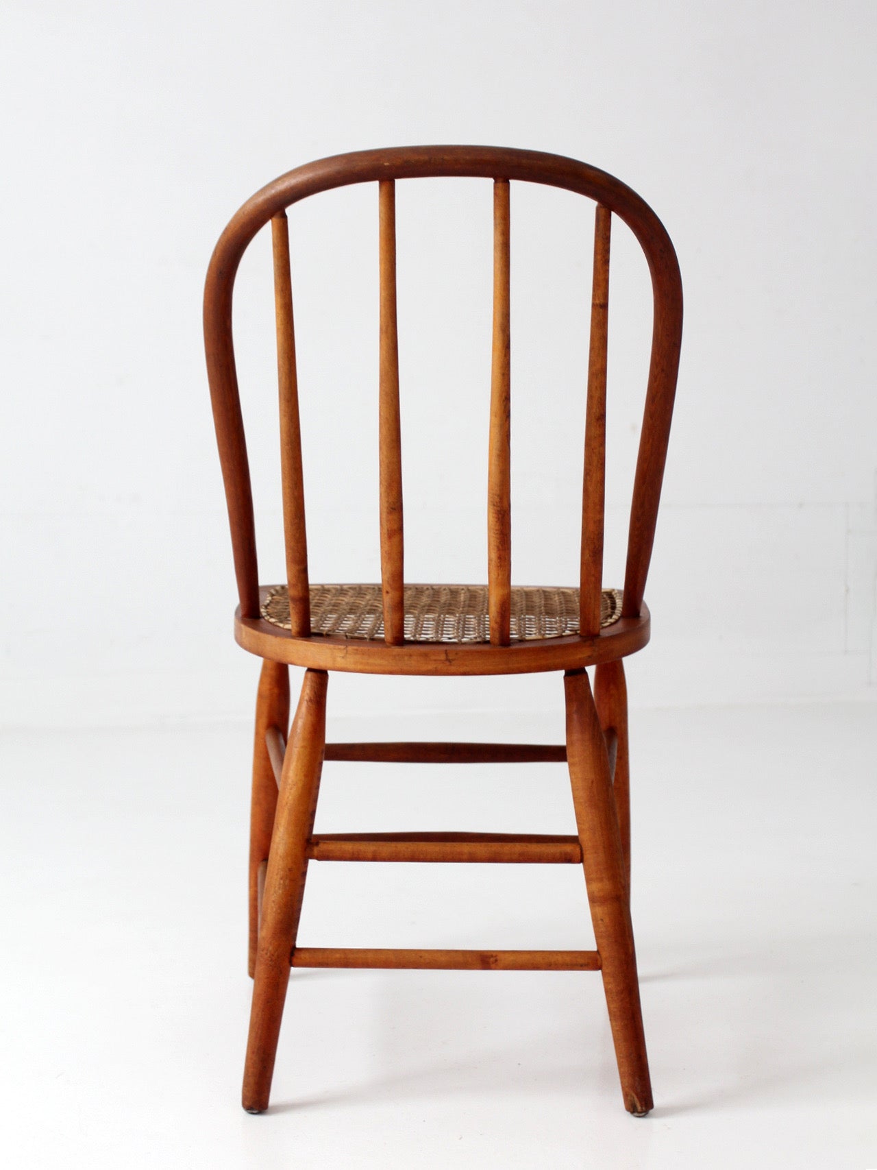 antique Windsor style cane seat chair
