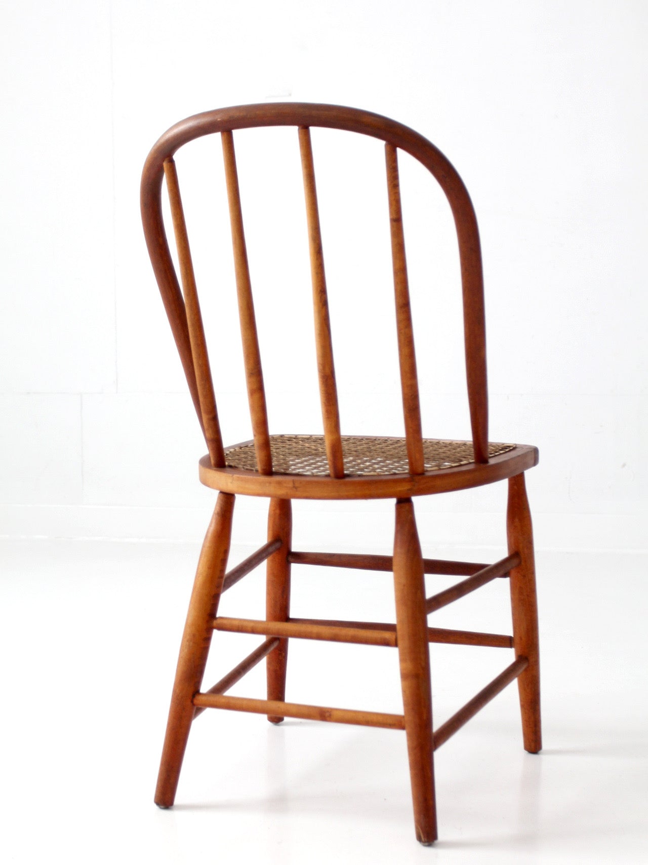 antique Windsor style cane seat chair
