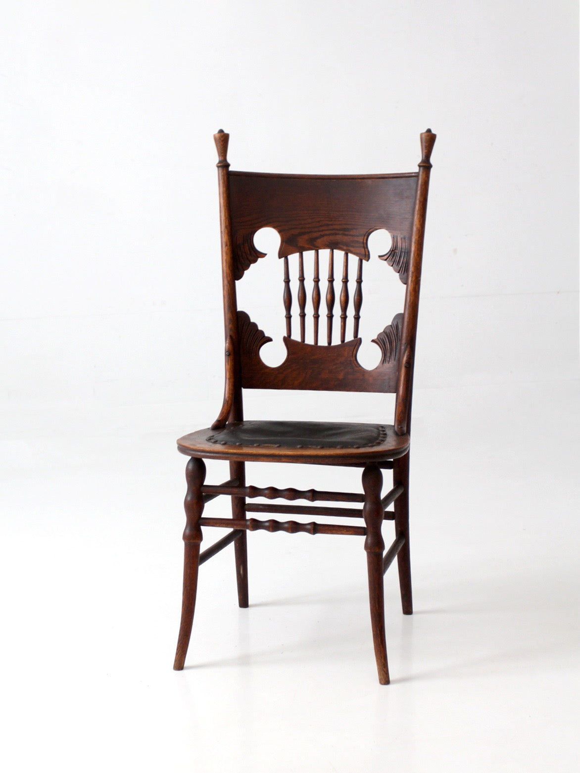 antique Eastlake Victorian oak side chair with leather seat