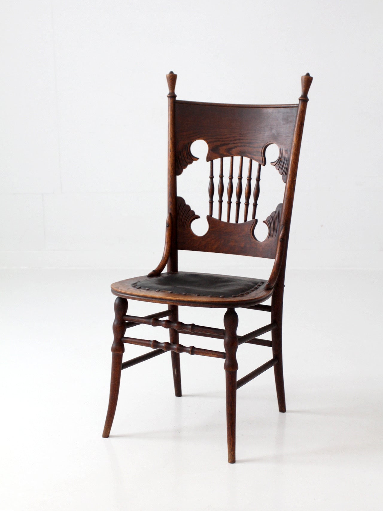 antique Eastlake Victorian oak side chair with leather seat