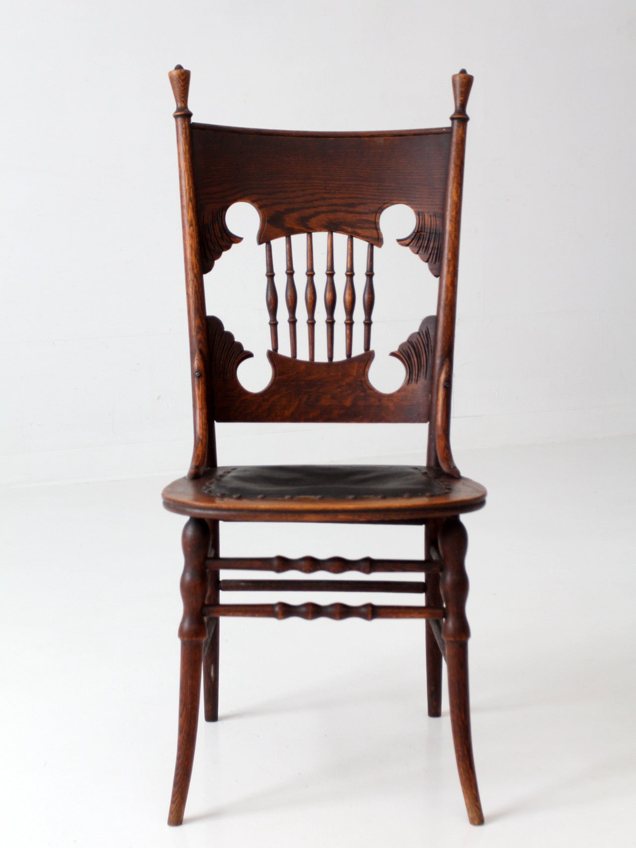 antique Eastlake Victorian oak side chair with leather seat