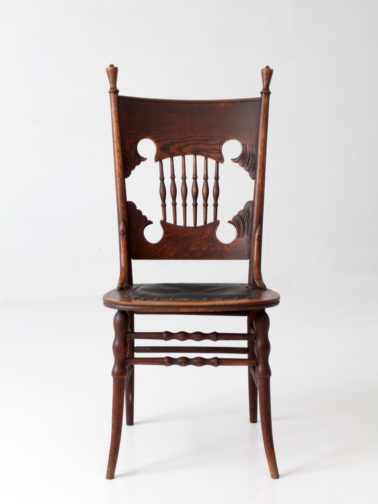 antique Eastlake Victorian oak side chair with leather seat
