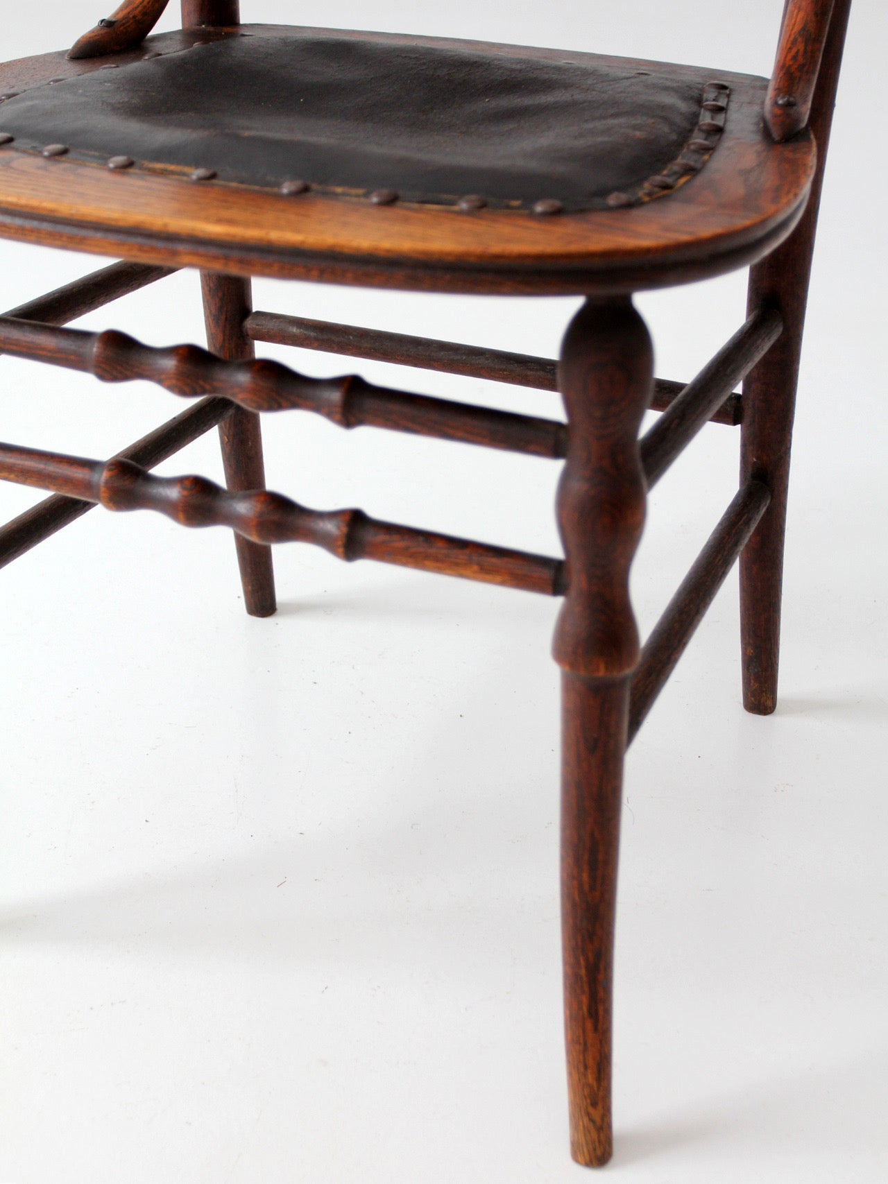 antique Eastlake Victorian oak side chair with leather seat