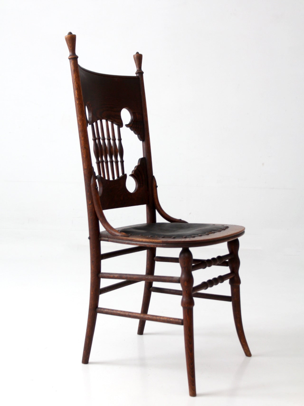 antique Eastlake Victorian oak side chair with leather seat