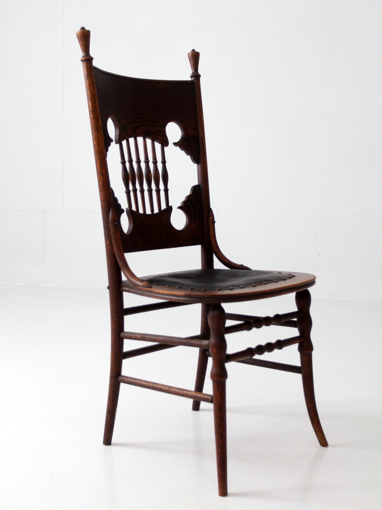 antique Eastlake Victorian oak side chair with leather seat