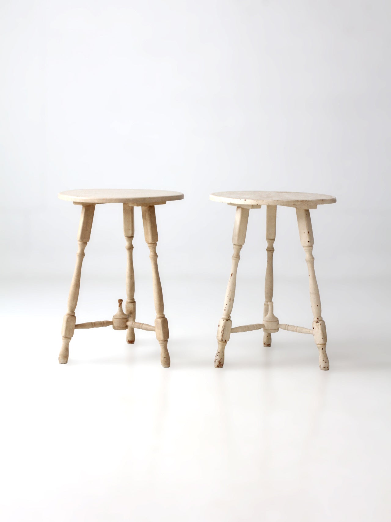pair of vintage cottage pedestal tables
